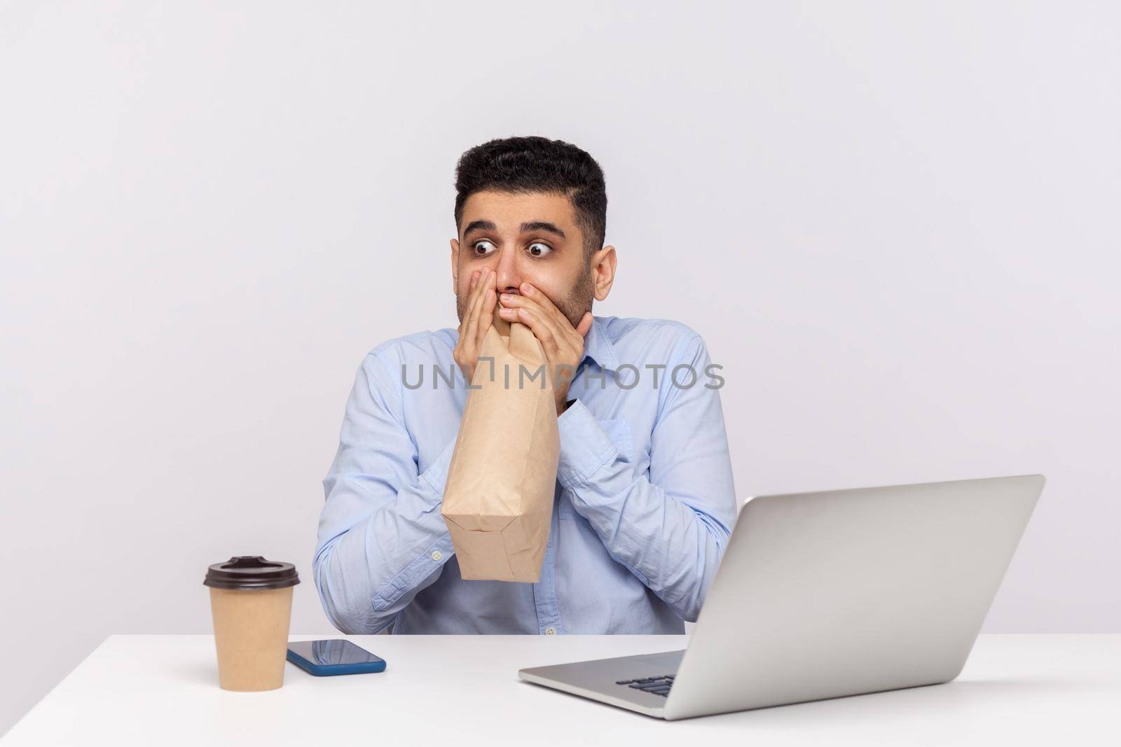 Emotional man sitting and working on office by Khosro1