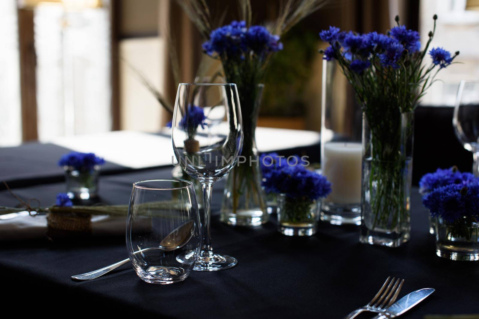 A set of furniture in a cafe. Vase with flowers decor for the restaurant. Black tablecloth by Ashtray25