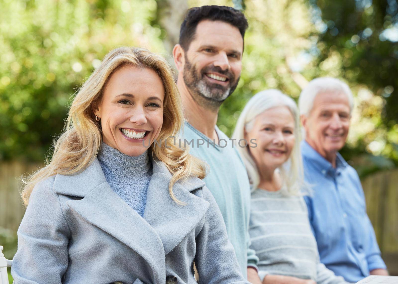 Shot of a couple spending time outdoors with their parents.