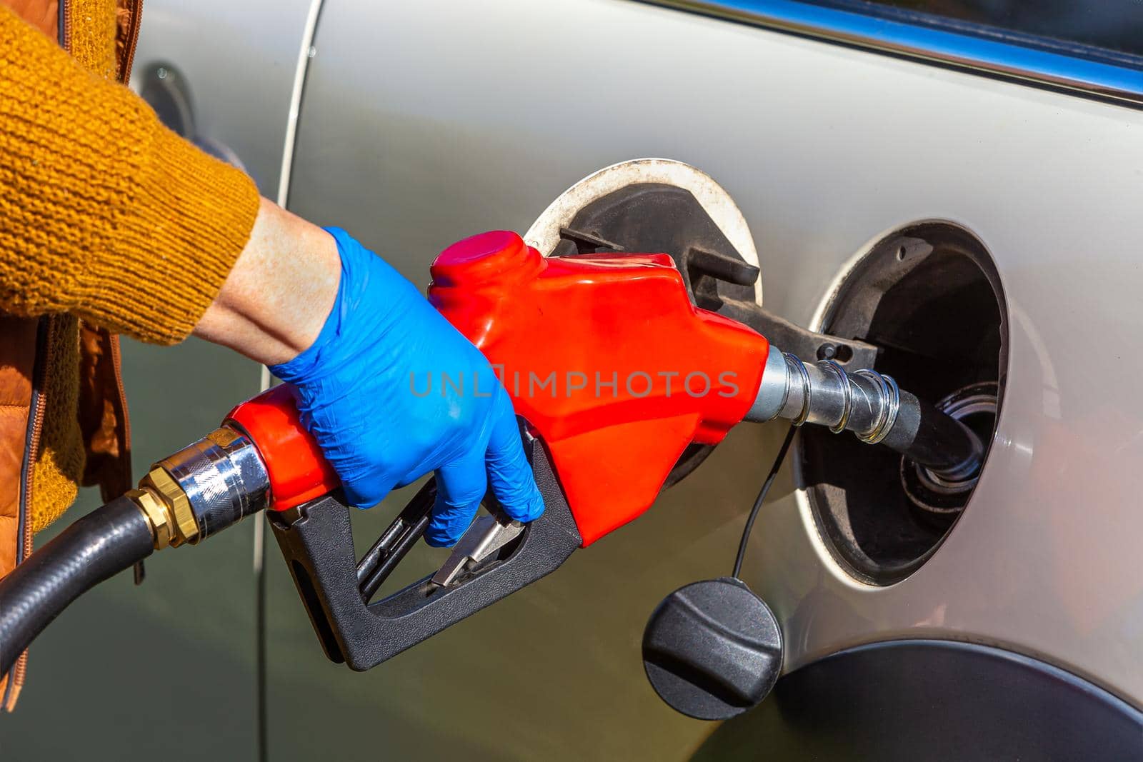 fuel price increase - Refueling a close-up car by JPC-PROD