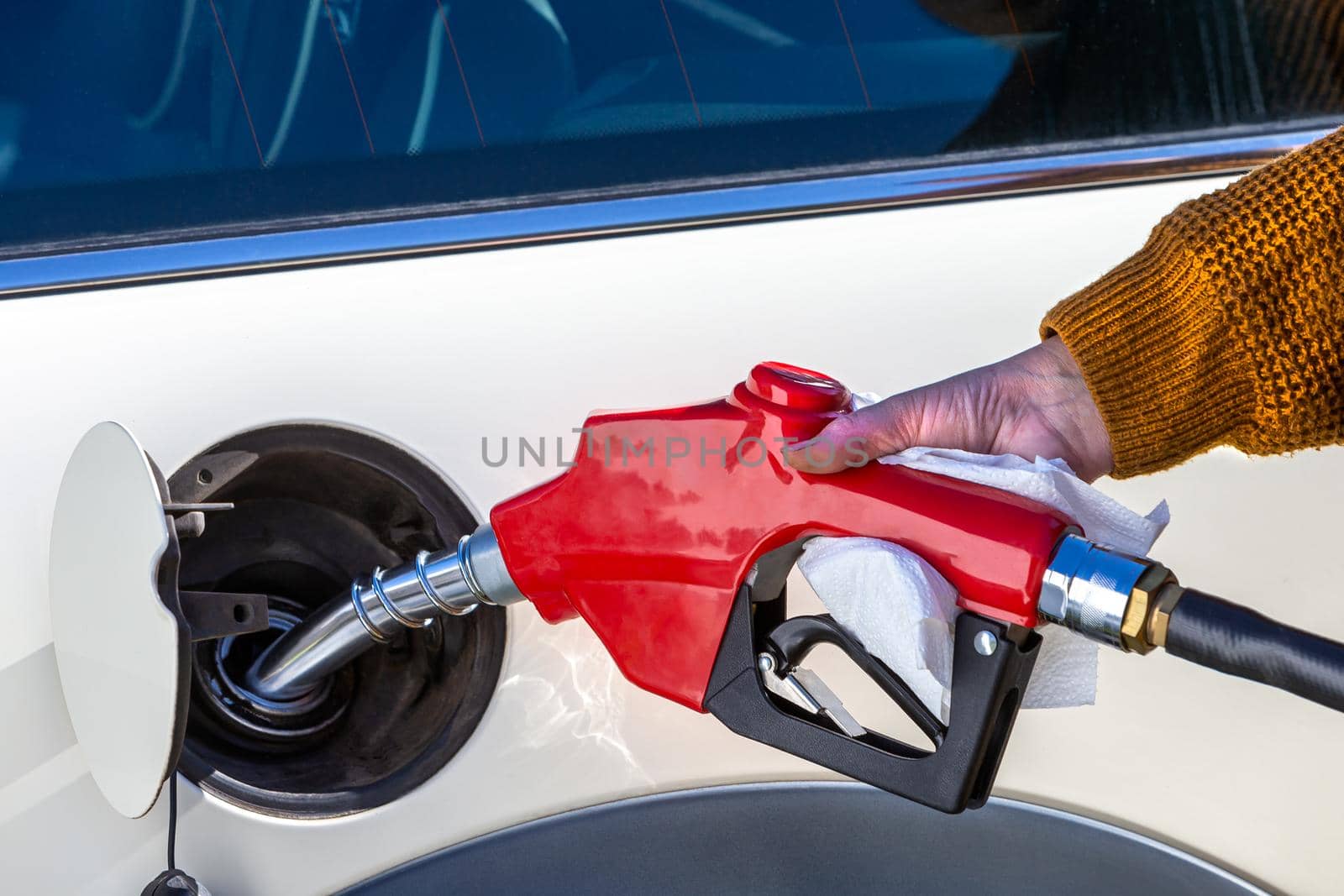 fuel price increase - Refueling a close-up car by JPC-PROD
