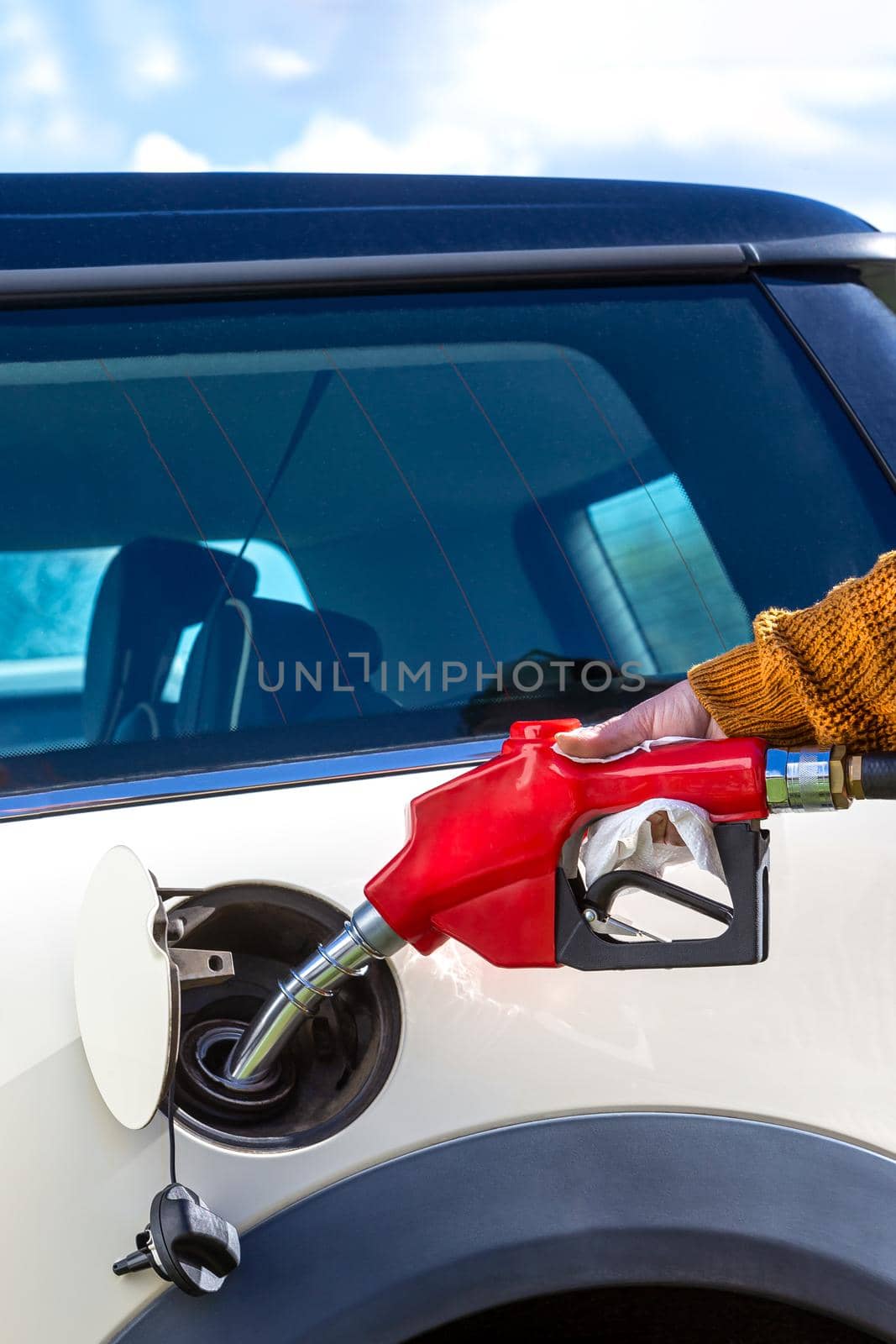 fuel price increase - Refueling a close-up car by JPC-PROD