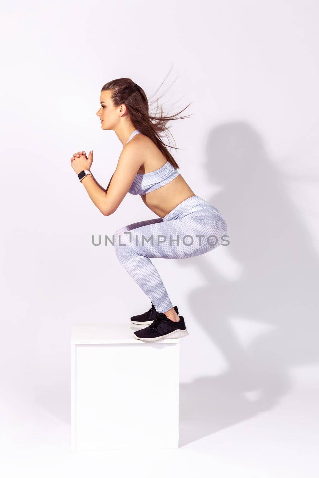 Indoor sport of young woman on white background. by Khosro1