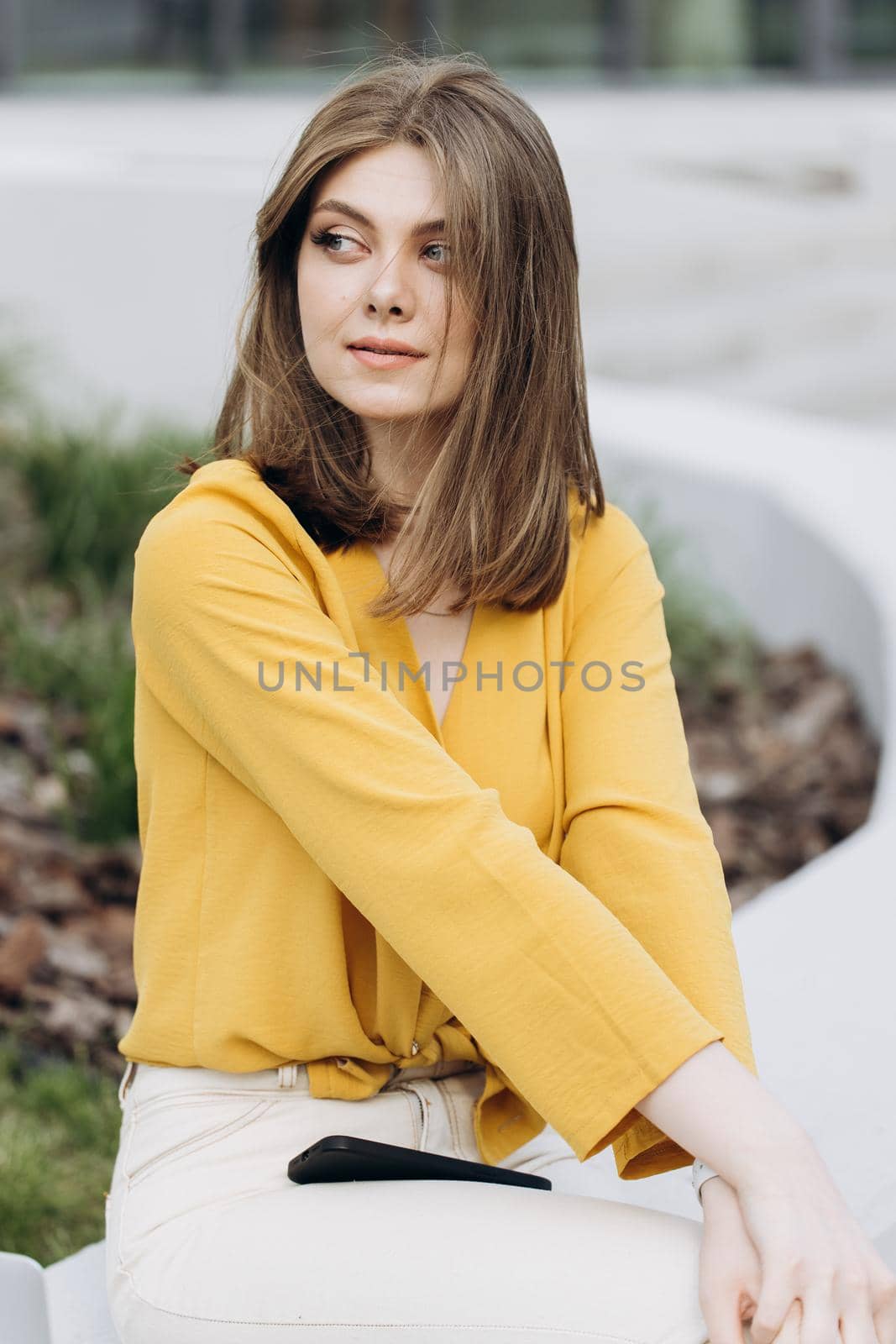 Young mixed-race elegant girl with blue eyes. Beautiful caucasian european woman looking stright outdoors. Outdoor relax. Happy relax. Female portraits