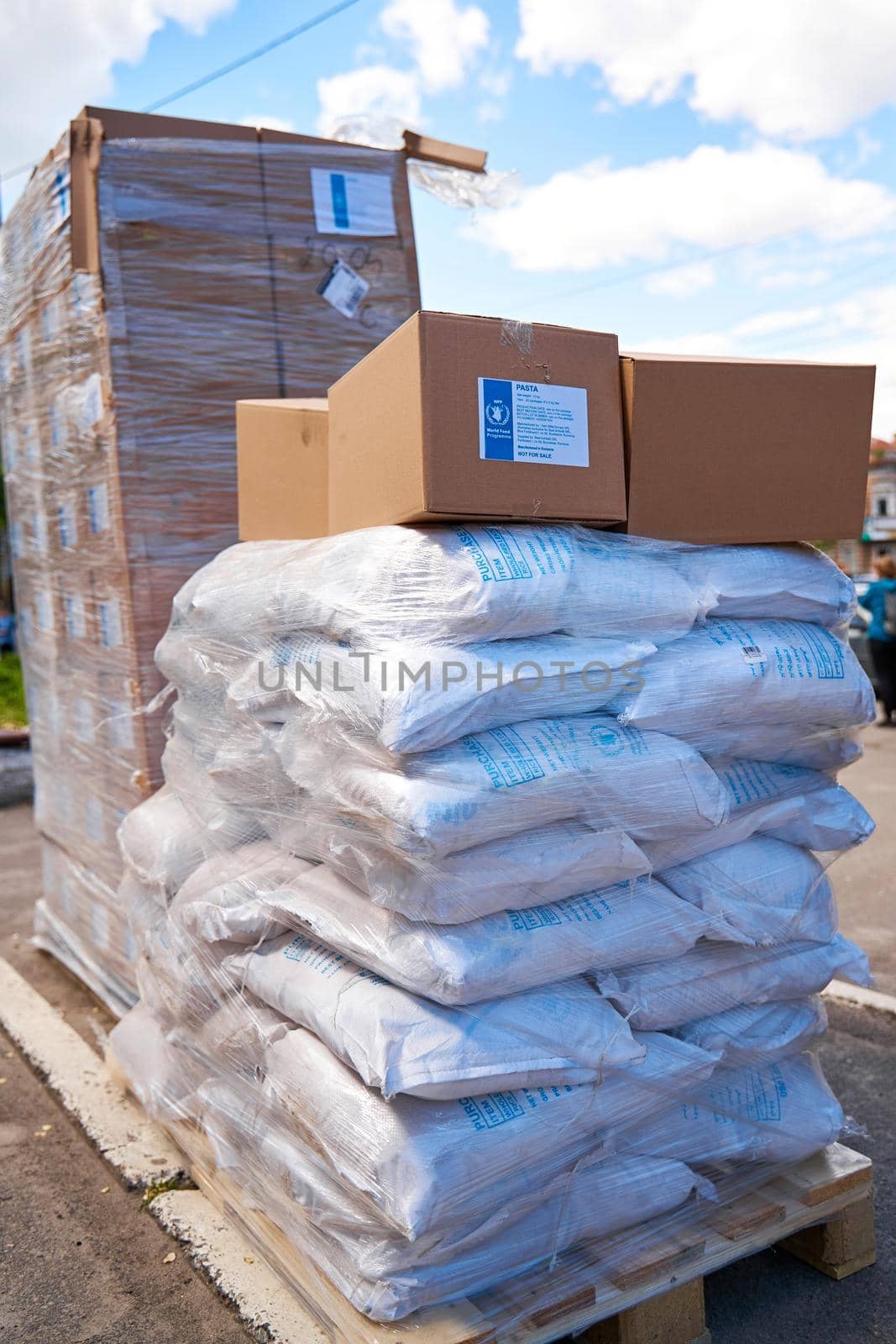 Humanitarian food aid unloaded in front of humanitarian centre. Dnipro, Ukraine - 05.17.2022