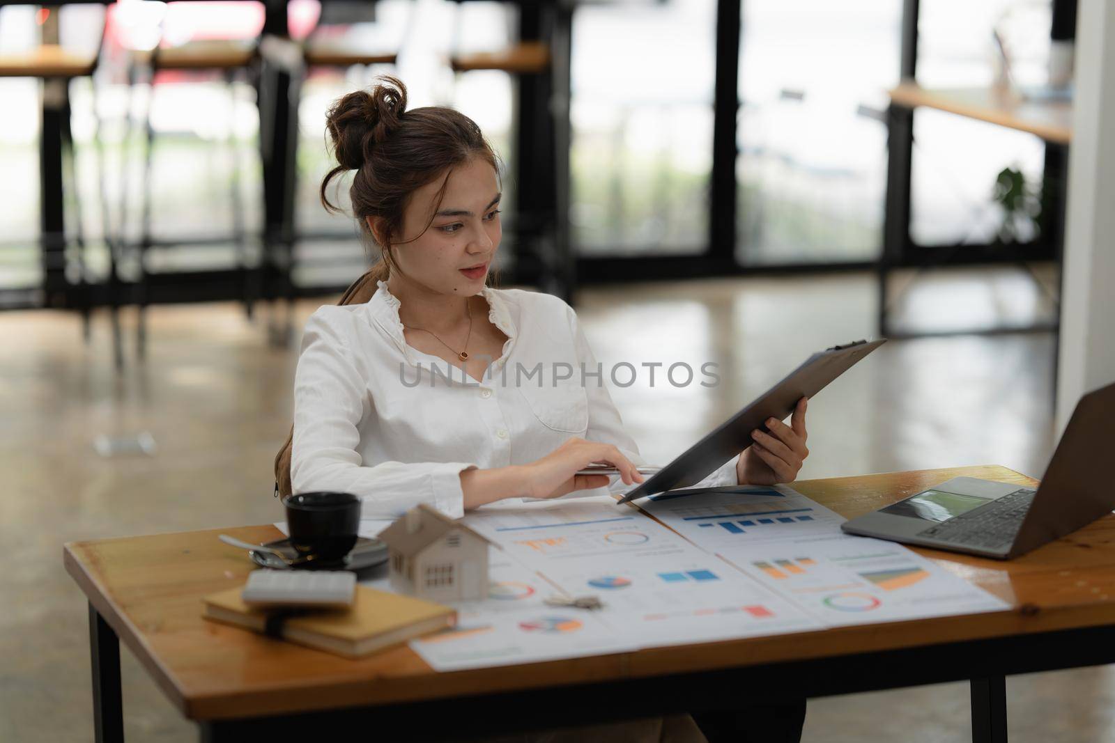 Image of Young woman working online on laptop computer. studying or working from home online concept
