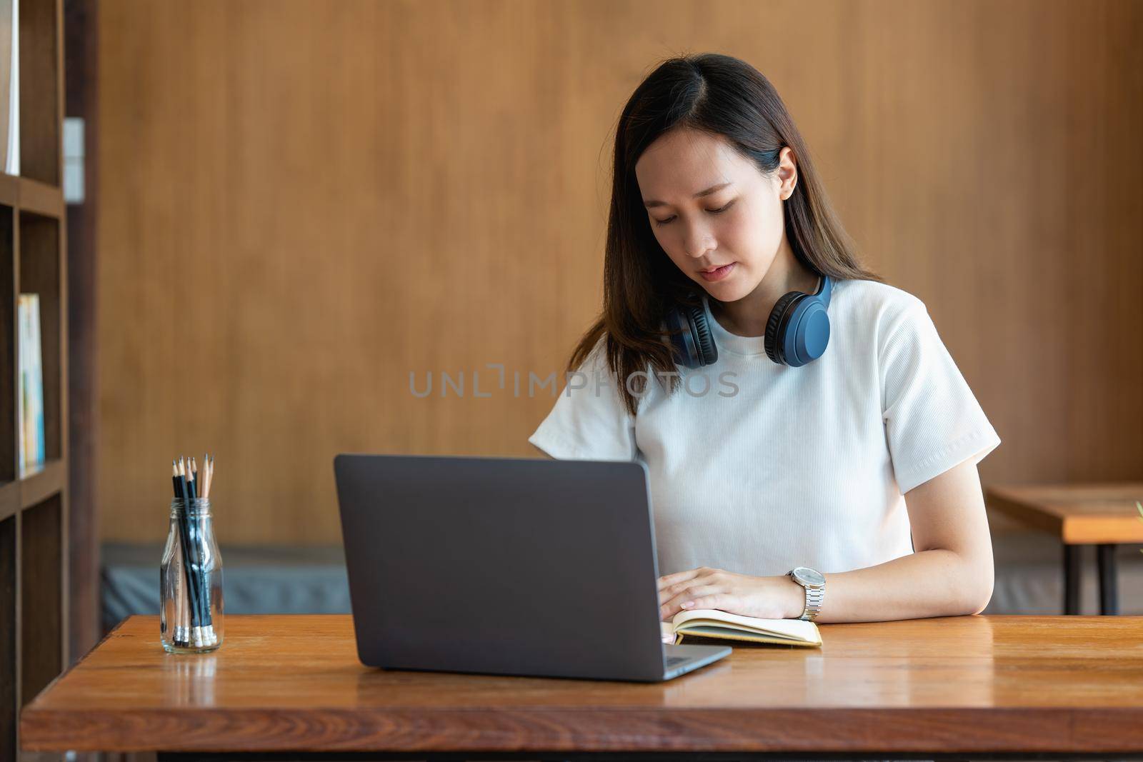 Image of Young woman stressed whlie exam online on laptop computer. studying or working from home online concept