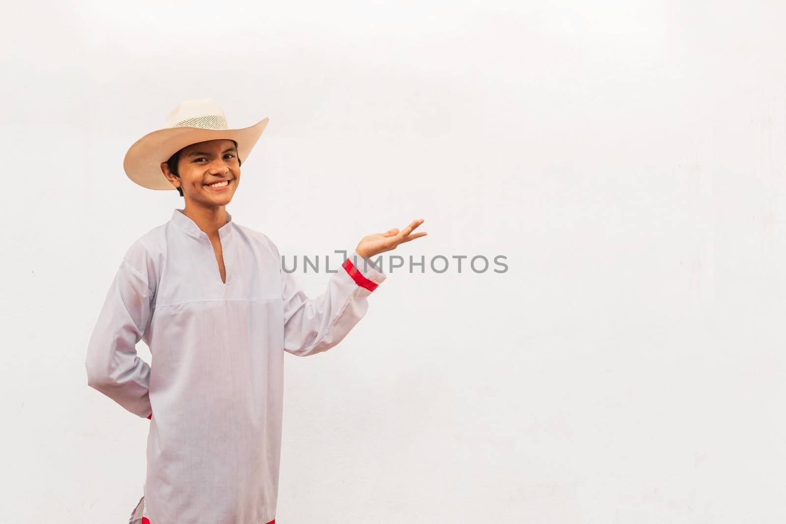 Latin teenager in the isolated white wall by cfalvarez