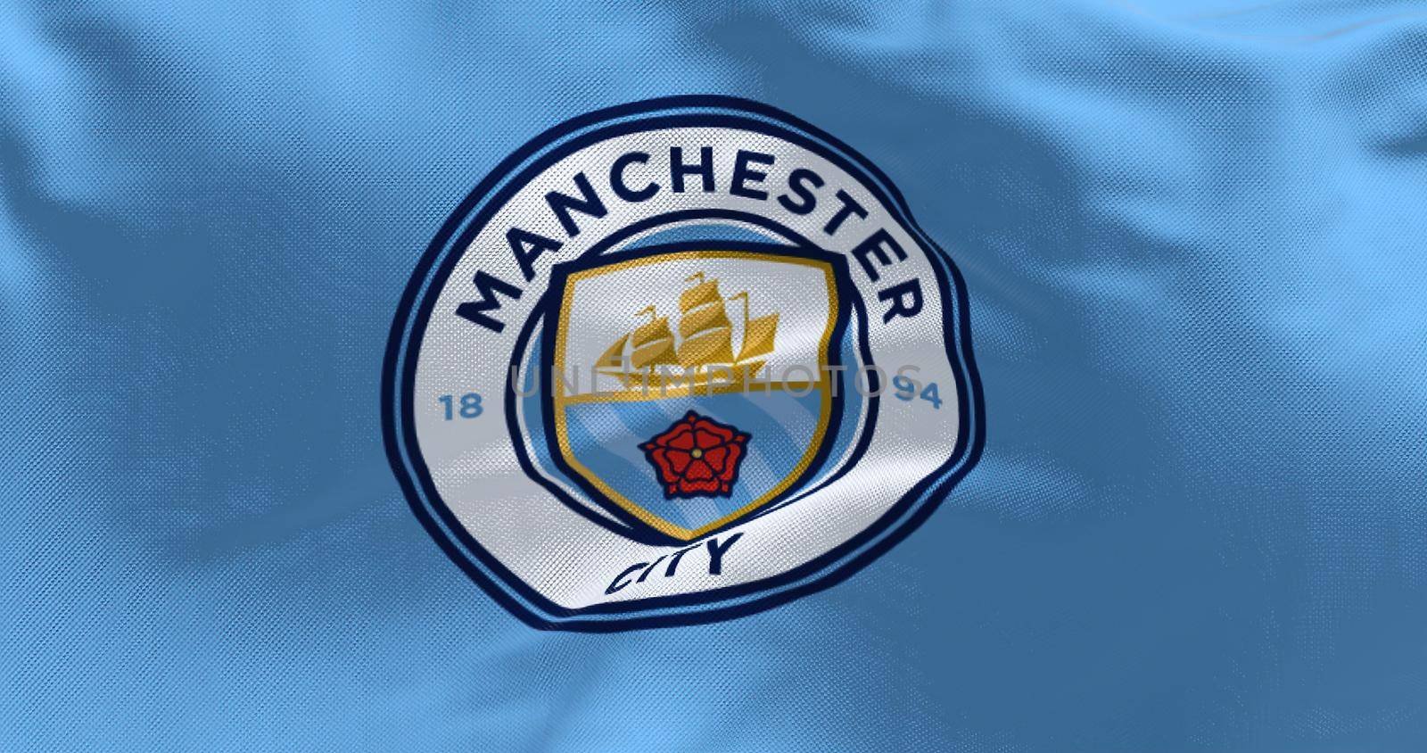 Manchester, UK, May 2022:Fabric background with the Manchester City Flag waving by rarrarorro