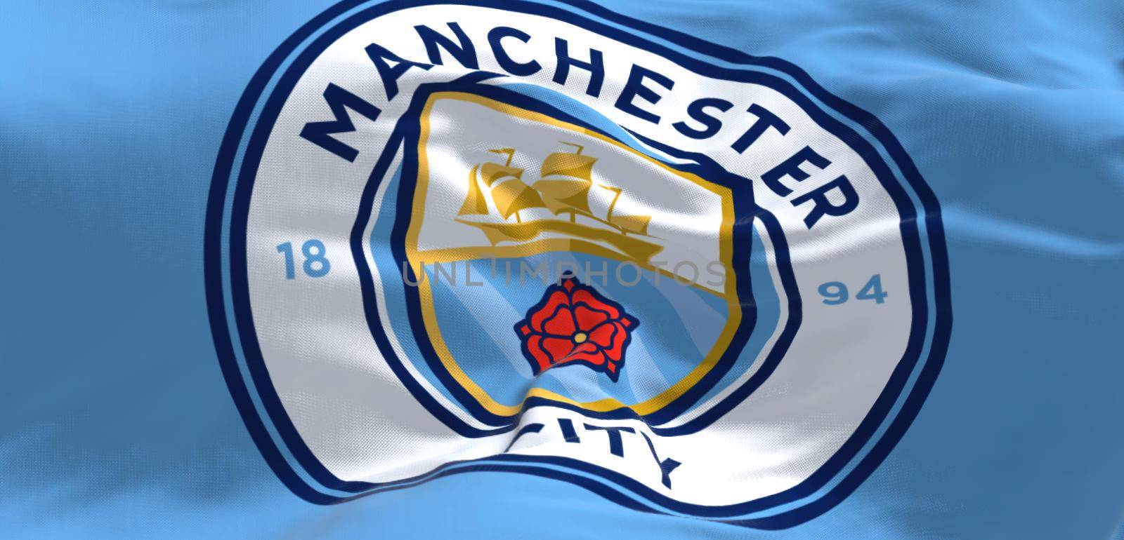 Manchester, UK, May 2022: Fabric background with the Manchester City Flag waving by rarrarorro