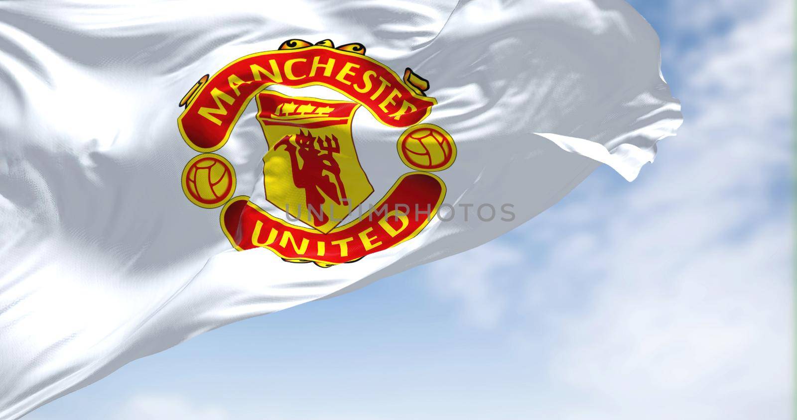 Manchester, UK, May 2022: The flag of Manchester City Football Club waving in the wind on a clear day by rarrarorro