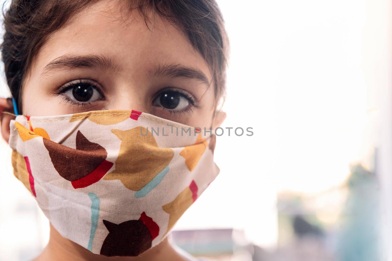 portrait of a little girl with a protective mask by raulmelldo