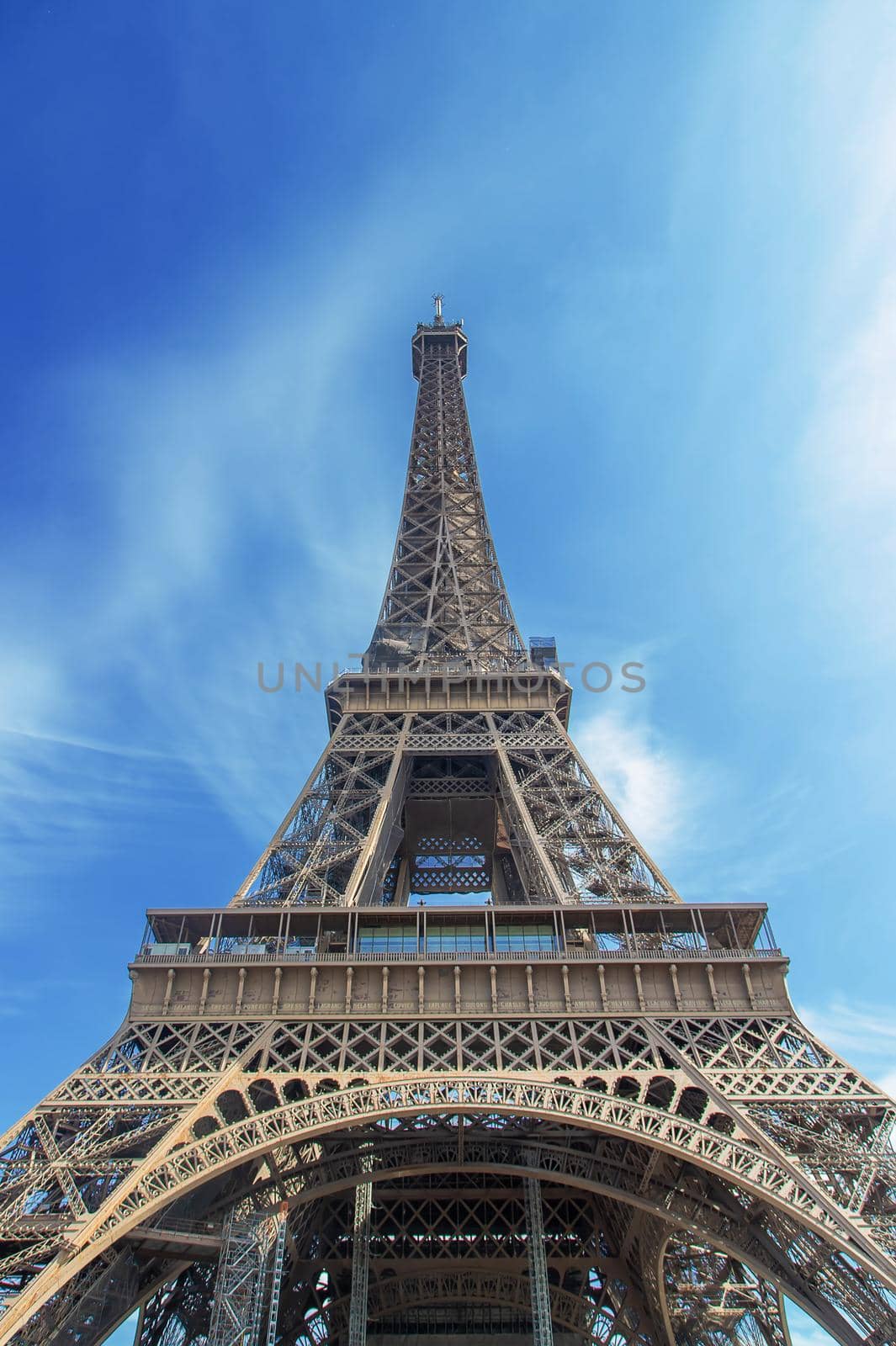 Eiffel tower in summer against the sky. Selective focus. by yanadjana