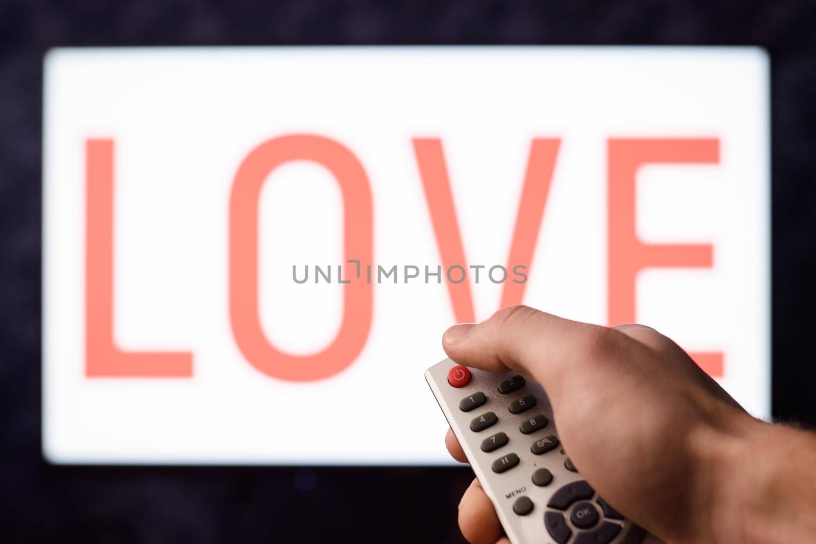 Man get bored with love decides to give it up pressing red button on a remote controller