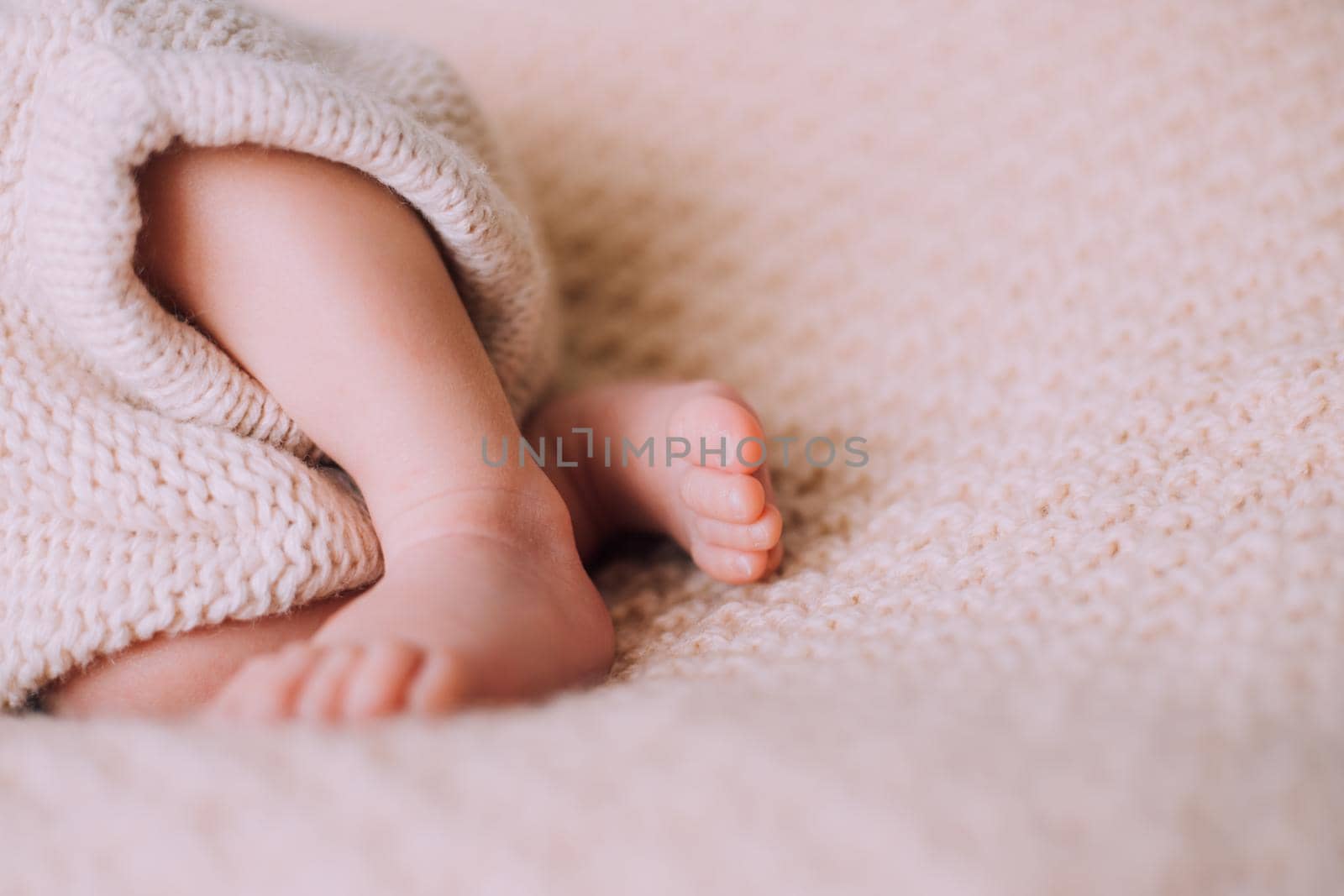 Legs of a newborn baby lifestyle . A small child. An article about newborns. Article about children's foot massage