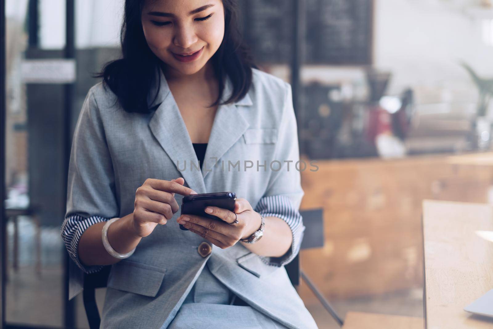 Woman using smartphone and searching about product online market. Shopping Online concept