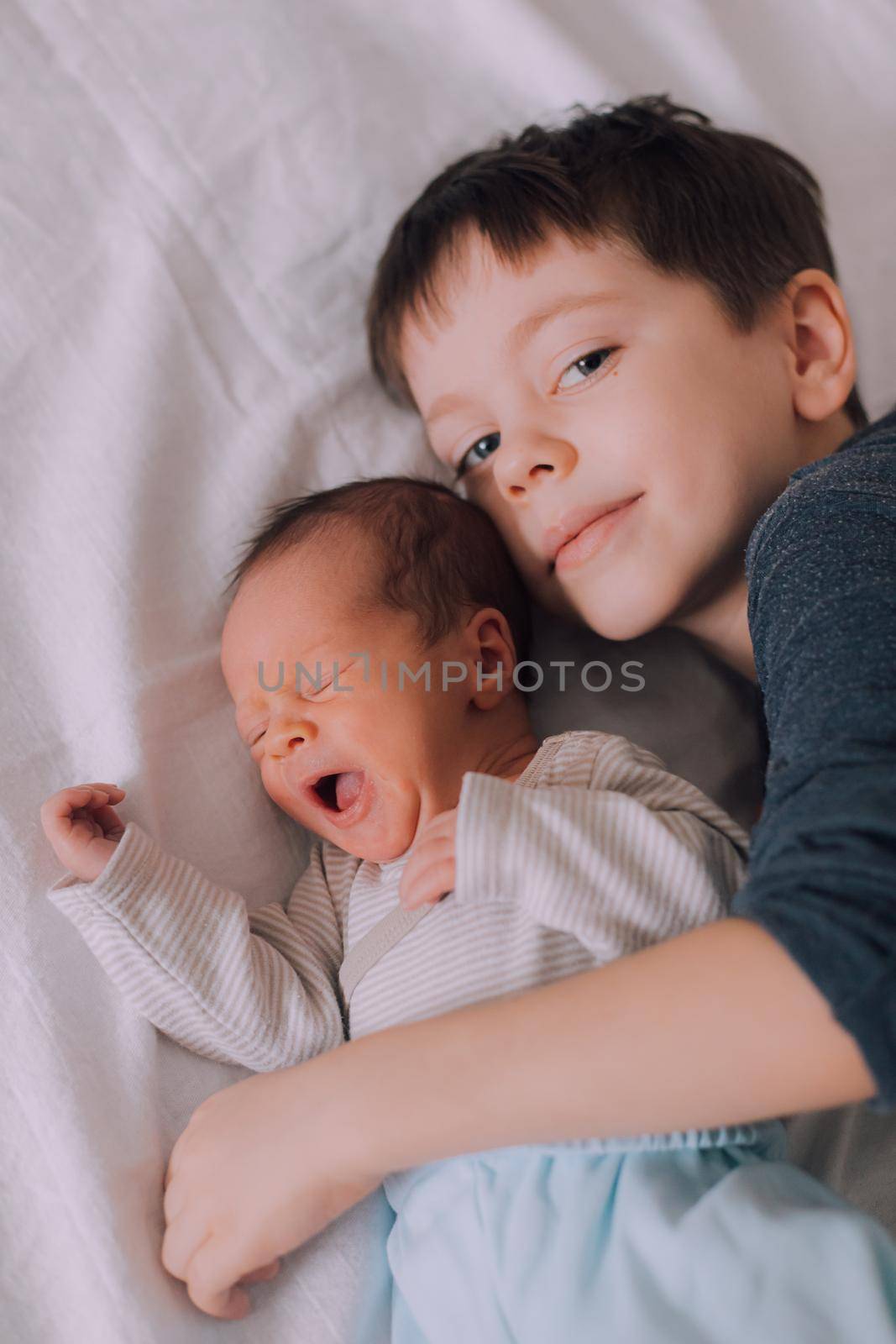 Two brothers lie lifestyle. An article about fraternal friendship. An article about the jealousy of brothers. An article about the age difference in children. An article about the relationship of children. Boys.