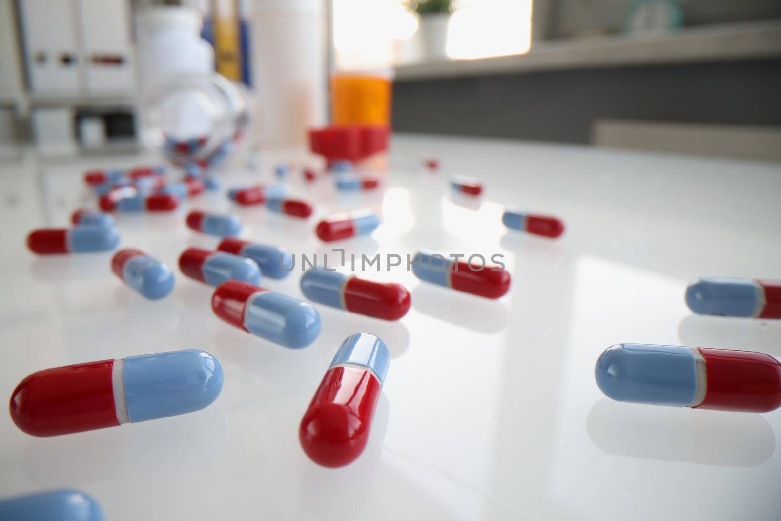 Scattered pills and medicines on table closeup. Uncontrolled use of drugs and cardiology