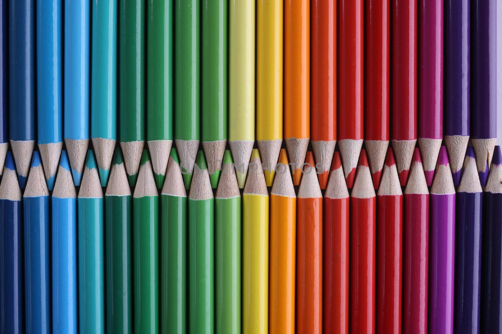 Set of colored pastel pencils in row of multicolor in form of closed zipper by kuprevich