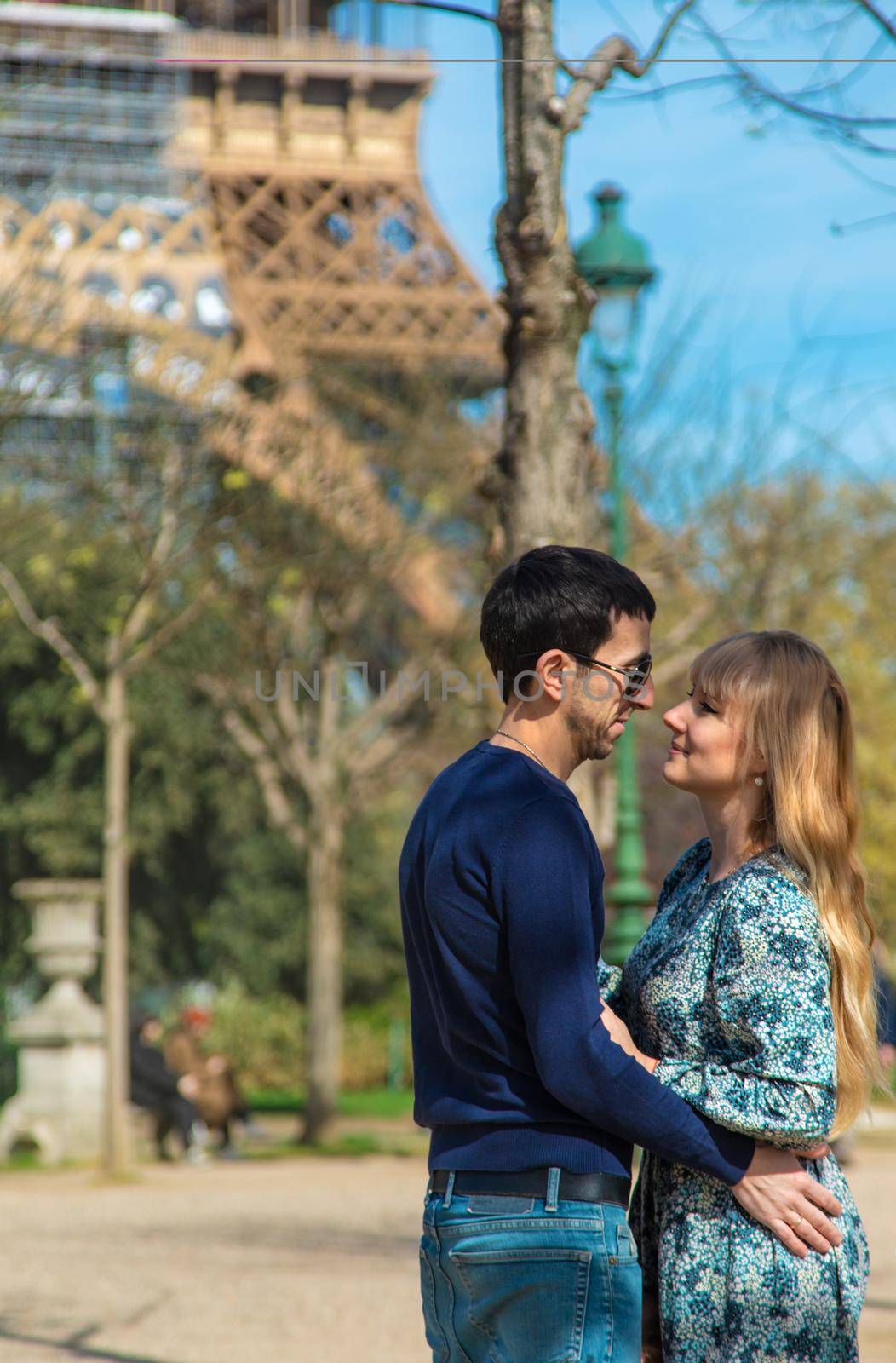Couple man and woman near the eiffel tower. Selective focus. People.