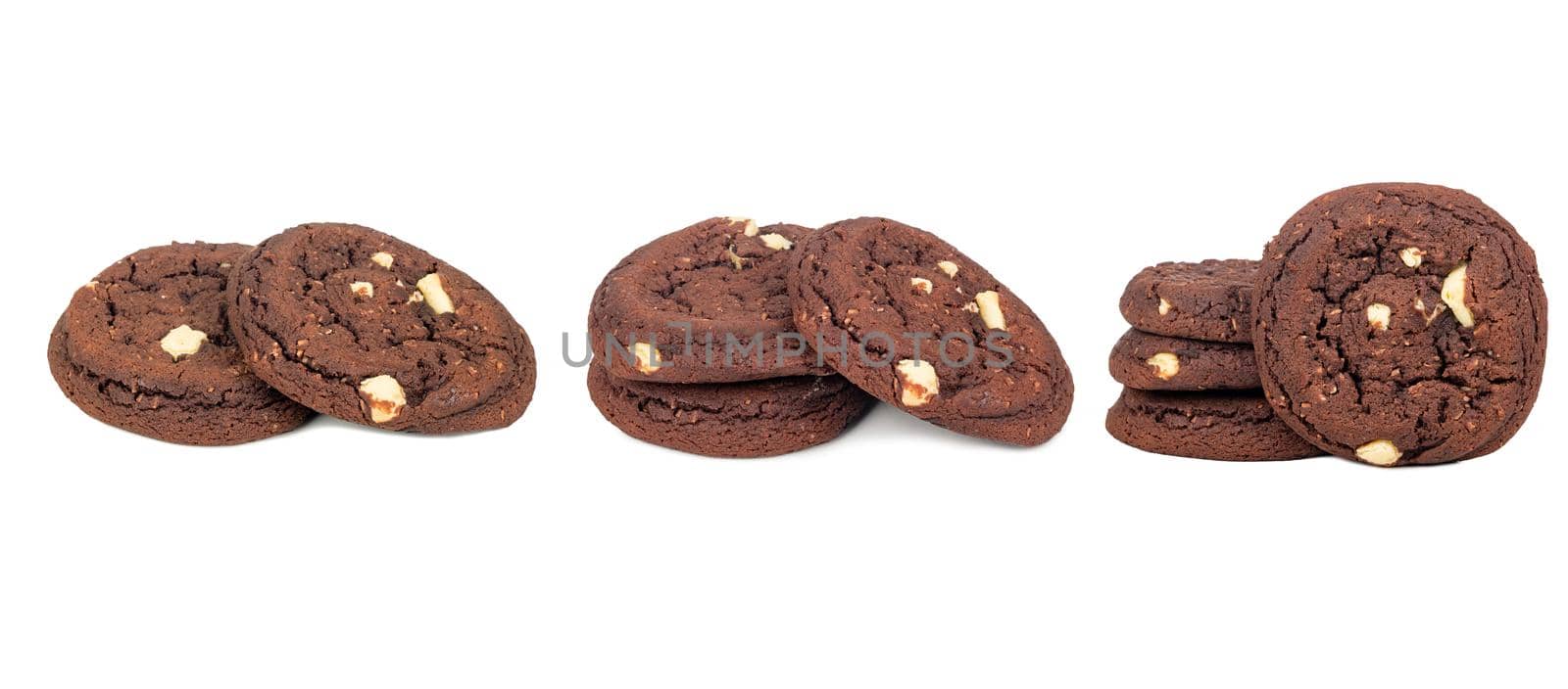 Isolated clipping path of die cut dark chocolate chip cookies piece stack and crumbs on white background of closeup tasty bakery organic homemade biscuit sweet dessert