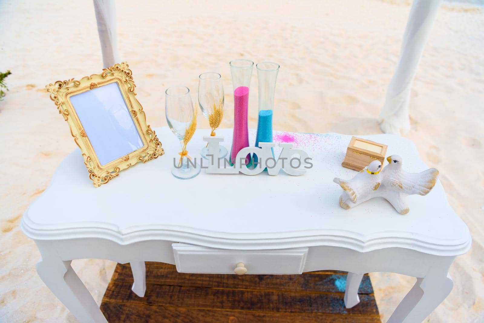 White table for a wedding ceremony on the seashore.