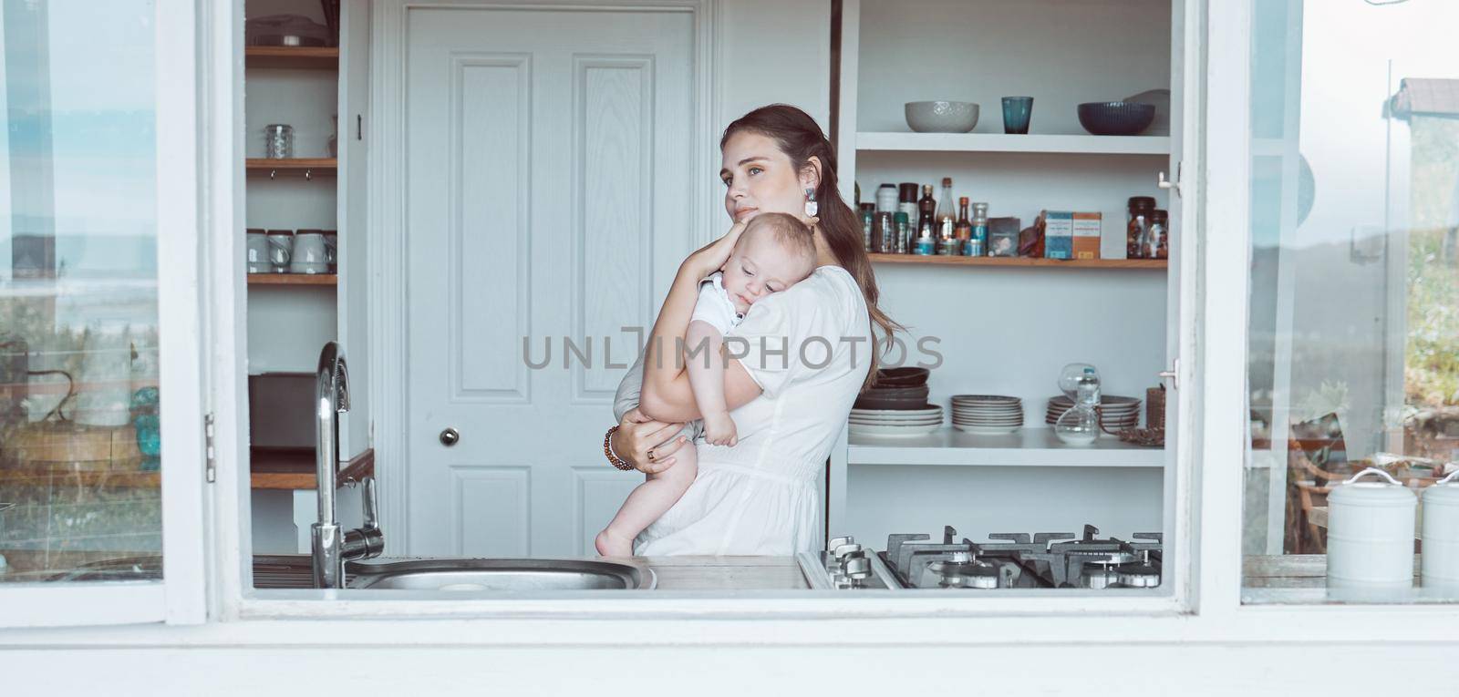 Shot of a beautiful young mother bonding with her newborn at home.