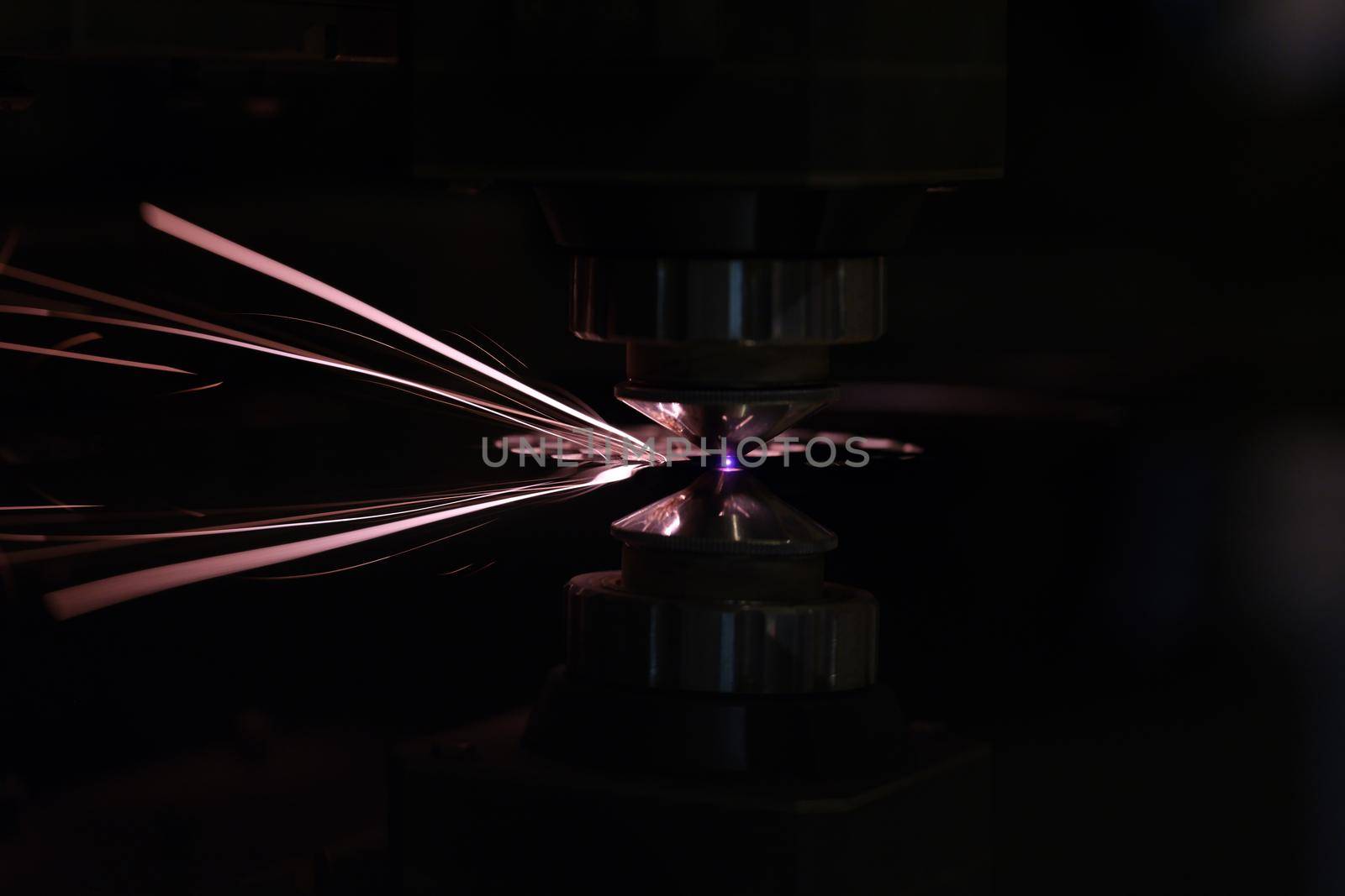 Process of cutting metal using plasma cutting in dark. Industry and metal processing concept