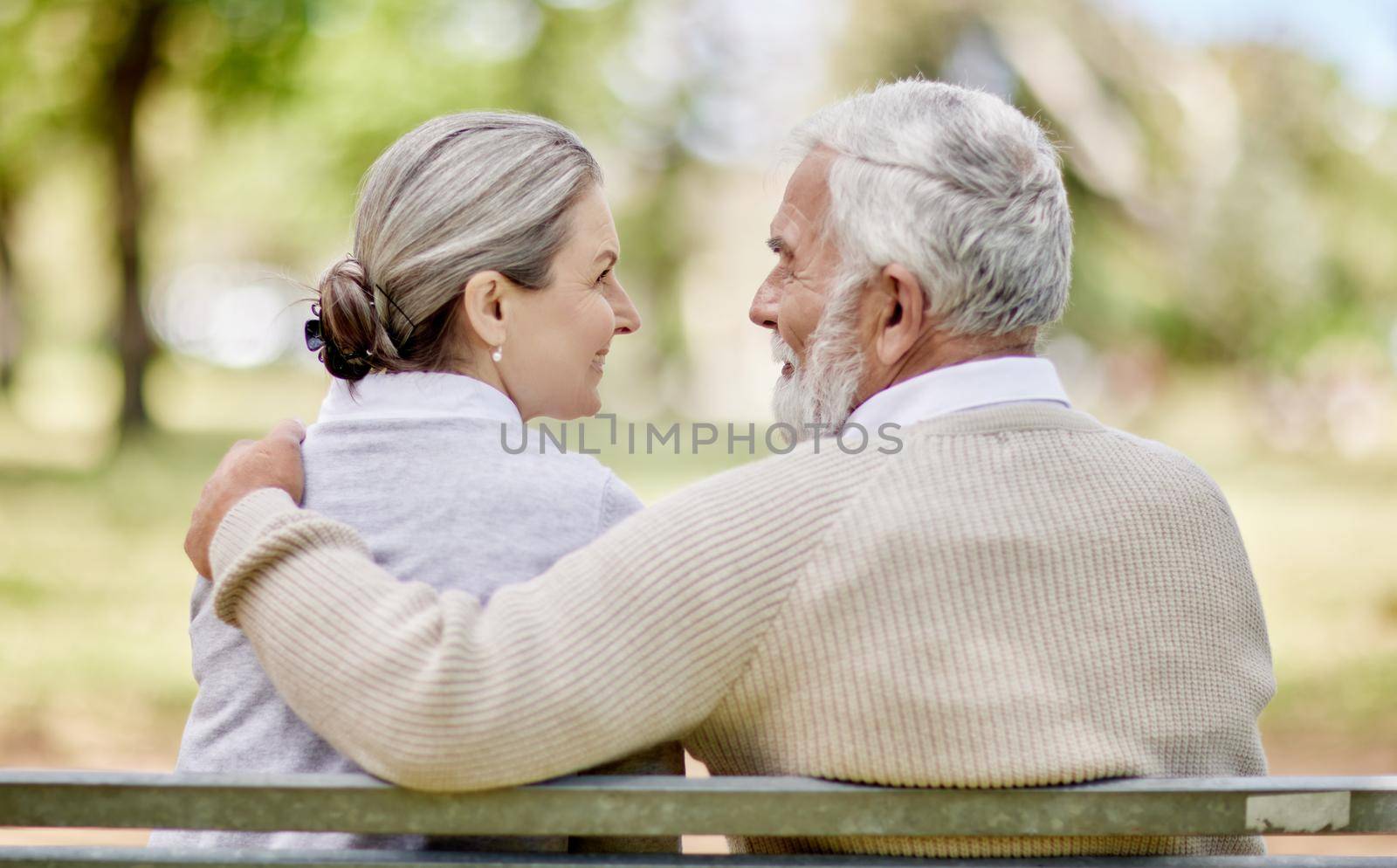 Youre so golden. Shot of a senior couple bonding outdoors together. by YuriArcurs