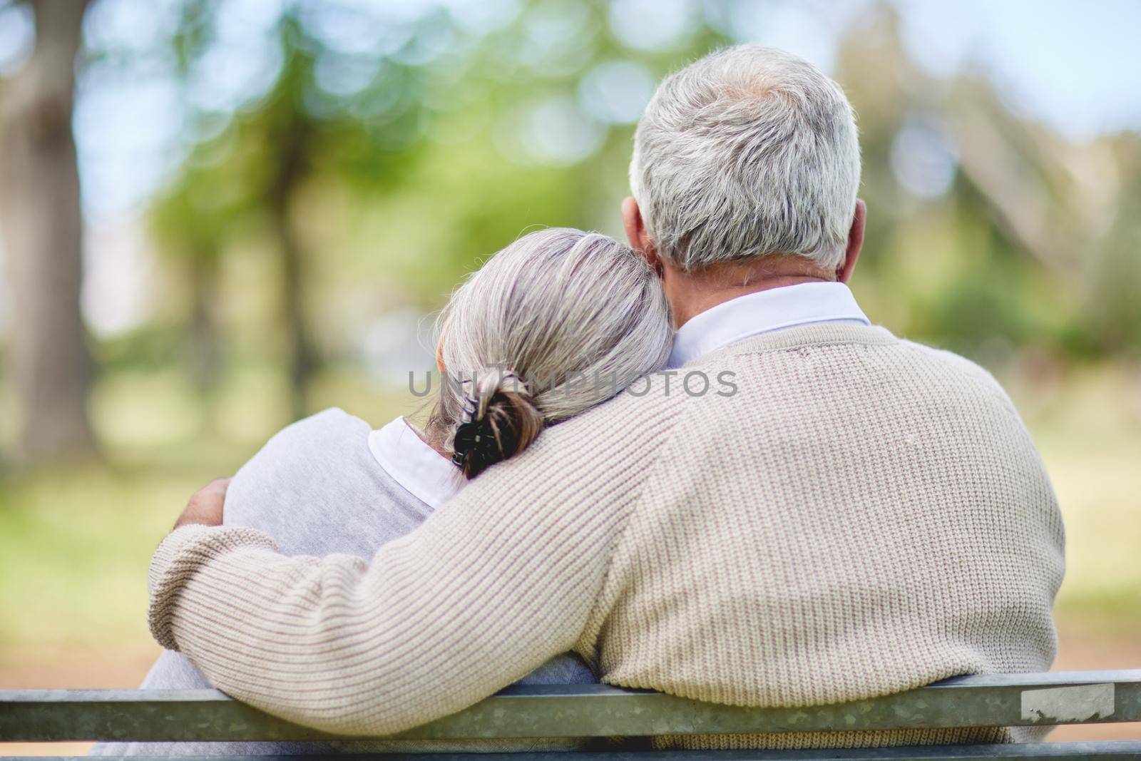 Love eliminates all fear. Shot of a senior couple bonding outdoors together. by YuriArcurs