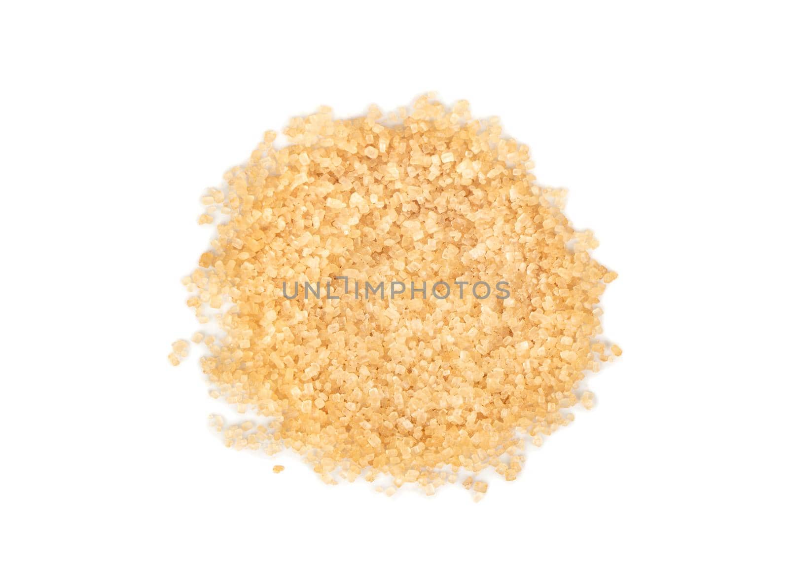 Pile of brown sugar on a white background, top view