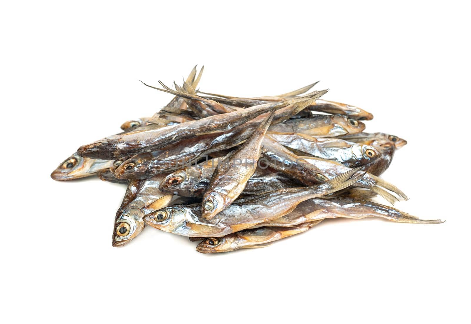 Pile of dry small fish on a white background