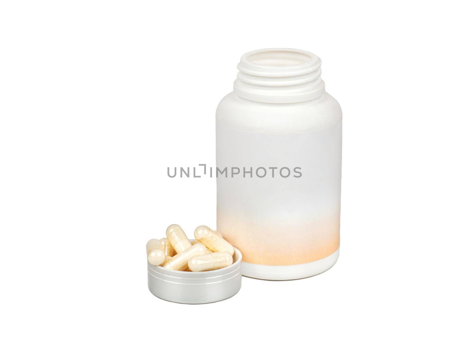 Capsules in a lid with a plastic jar isolated on a white background