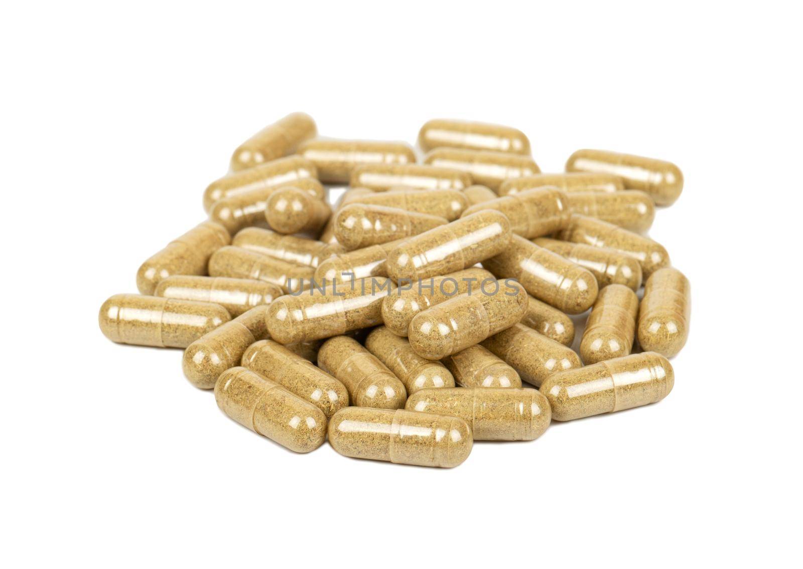 Pile of scattered homeopathic capsules on a white background
