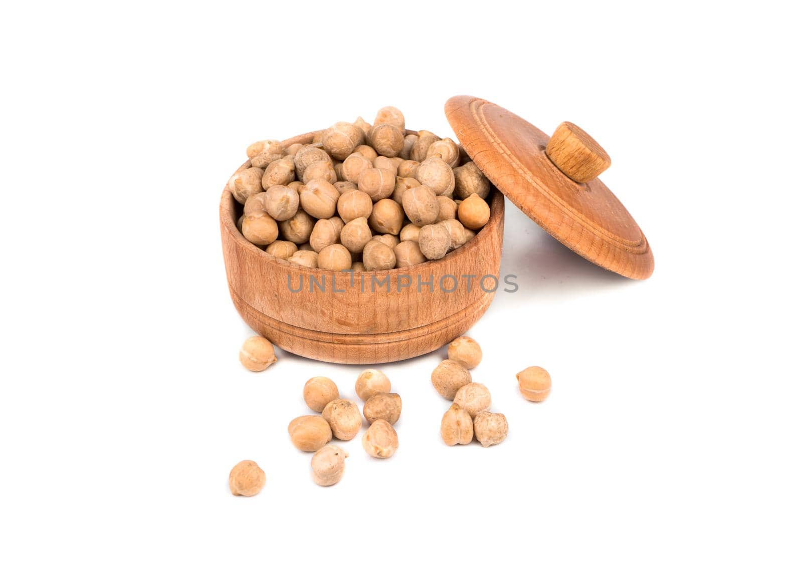 Dry chickpeas in a wooden bowl on white background