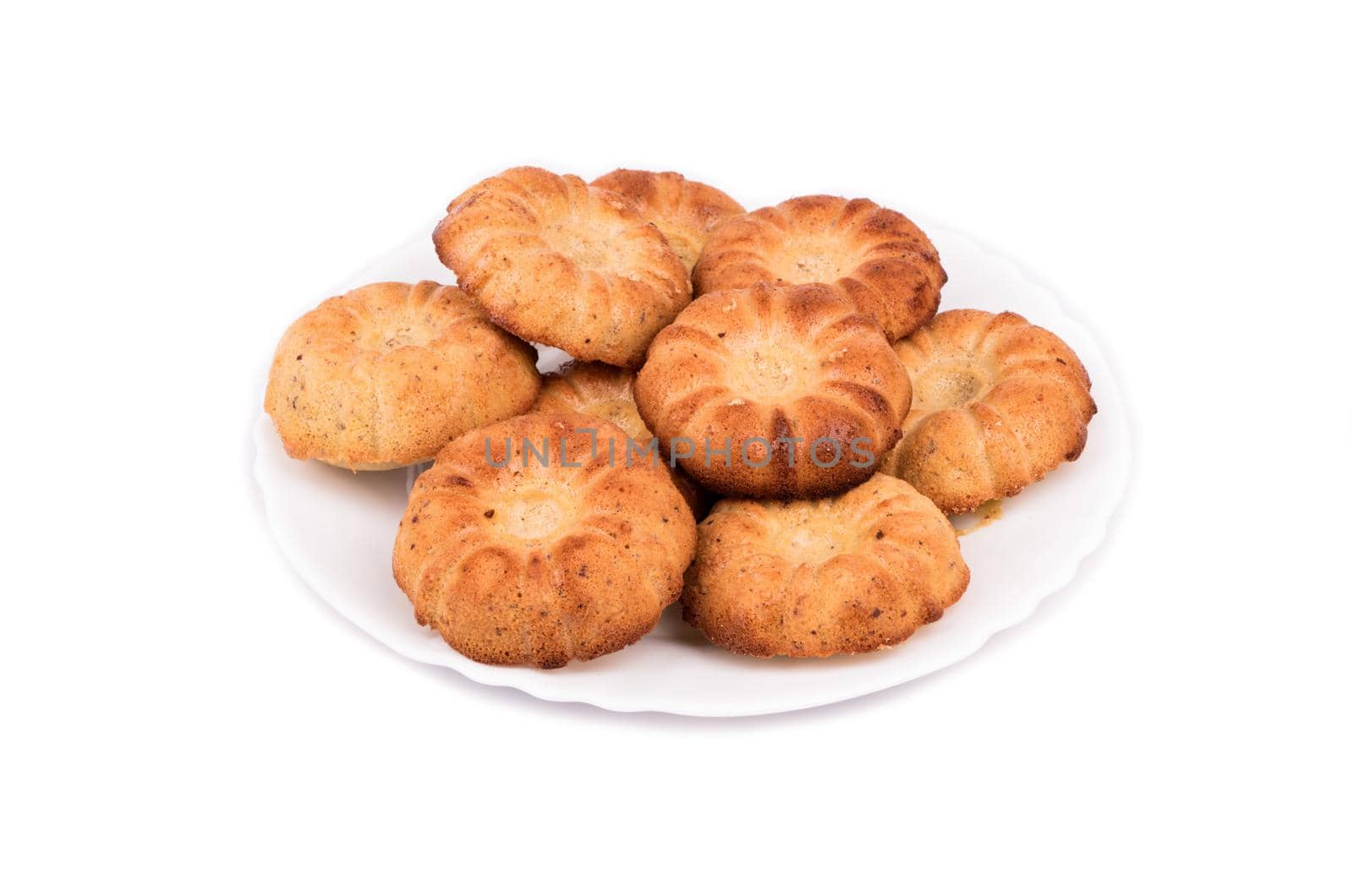 Homemade fresh baked cookies on a plate on a white background
