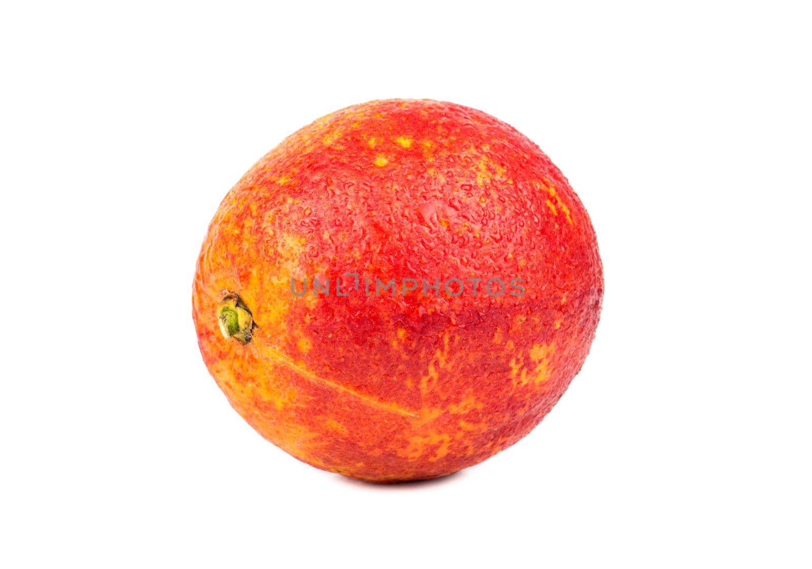 Ripe tropical fruit Sicilian orange with drops on a white background