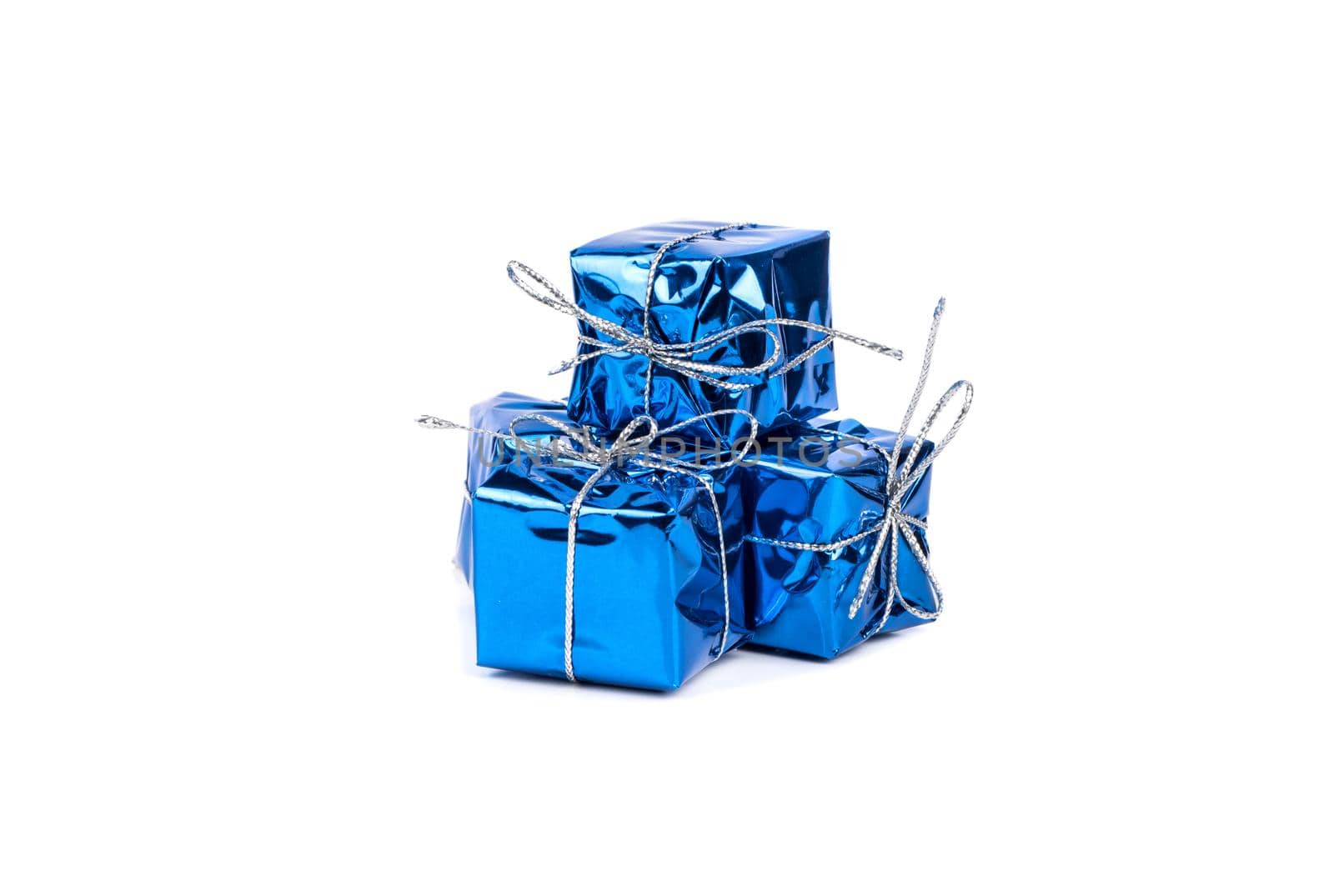 Several small blue boxes with gifts on a white background