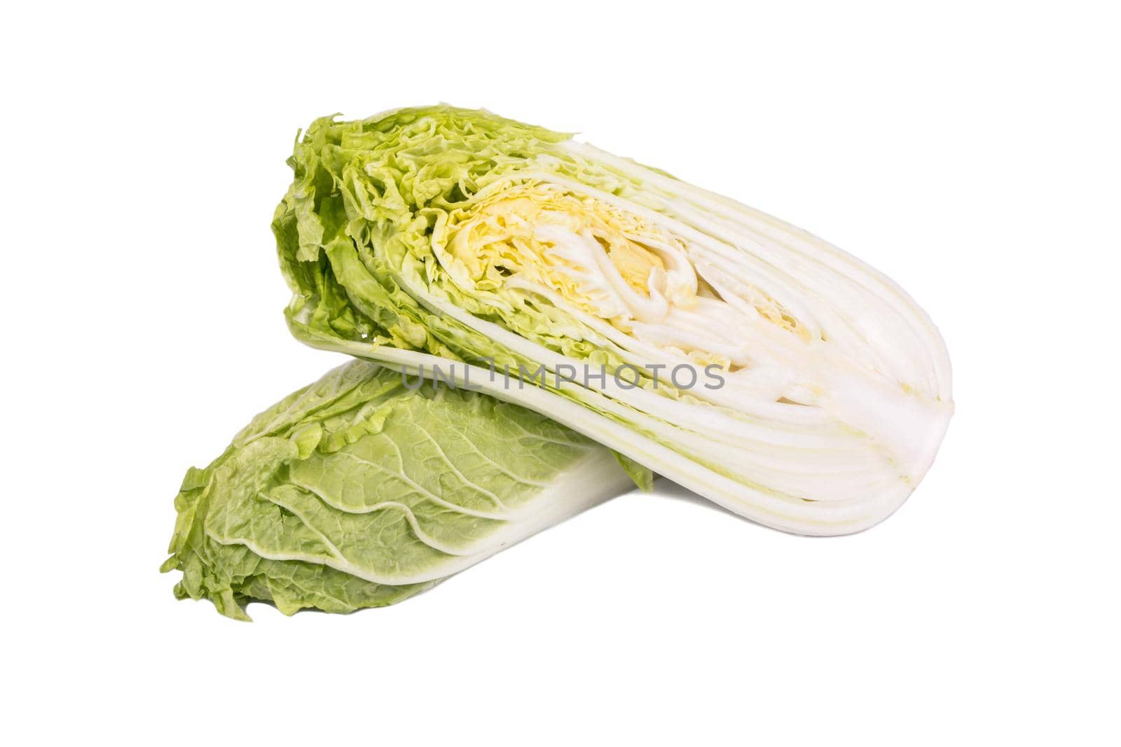 Fresh chinese cabbage cut into halves on white background