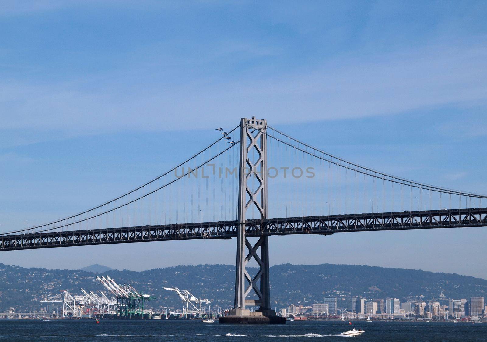 four Blue Angels fly behind the San Francisco Bay Bridge by EricGBVD