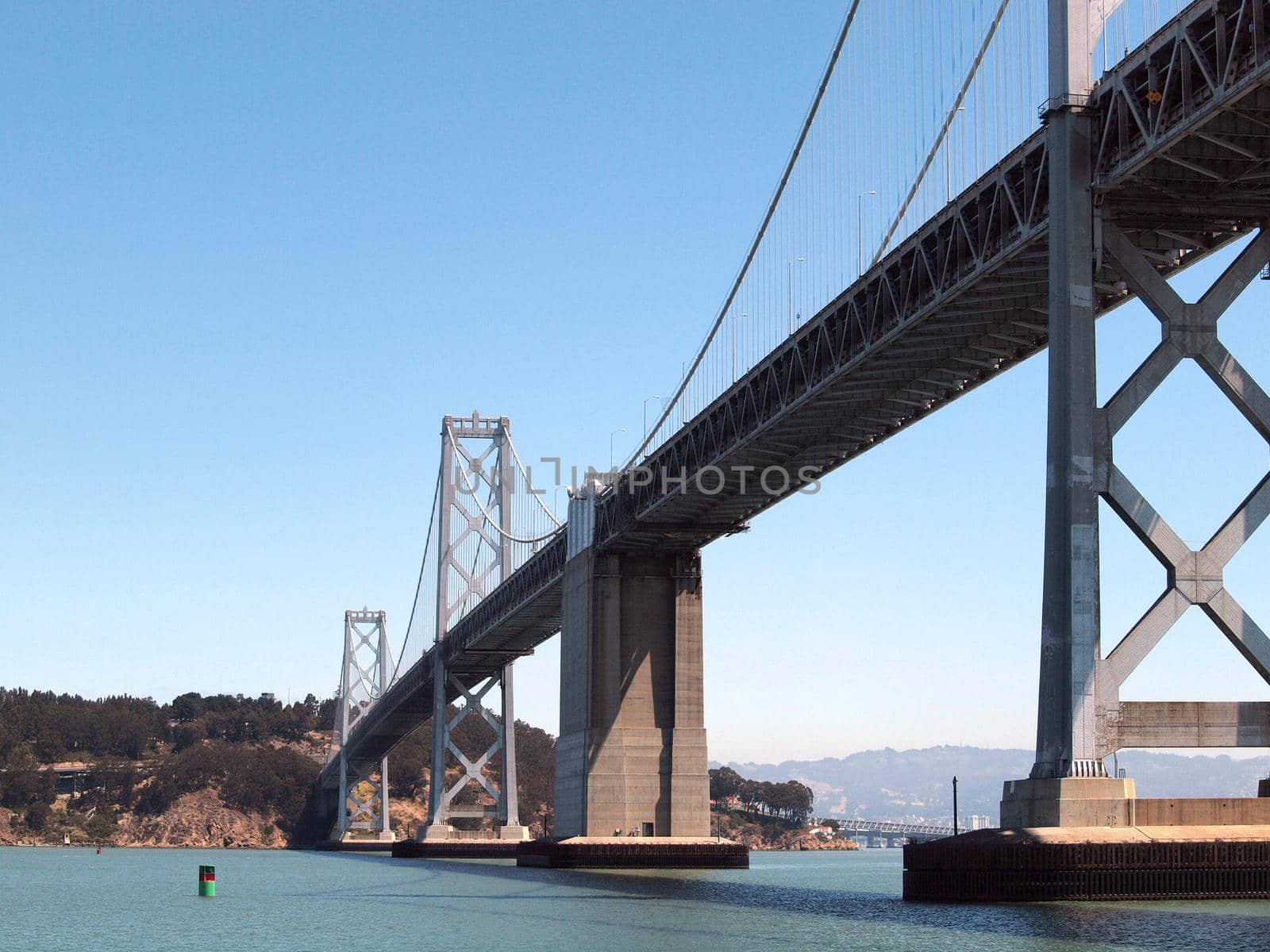 San Francisco side of Bay Bridge from ferry boat sailing underneath  by EricGBVD