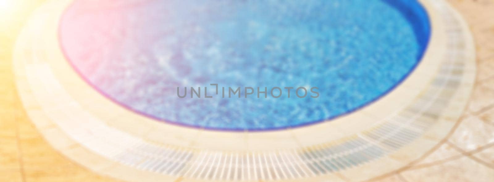 Abstract defocused pool with blue water background. Panorama of pool bottom with tile pattern and transparent water. Summer travel and vacation background concept by panophotograph