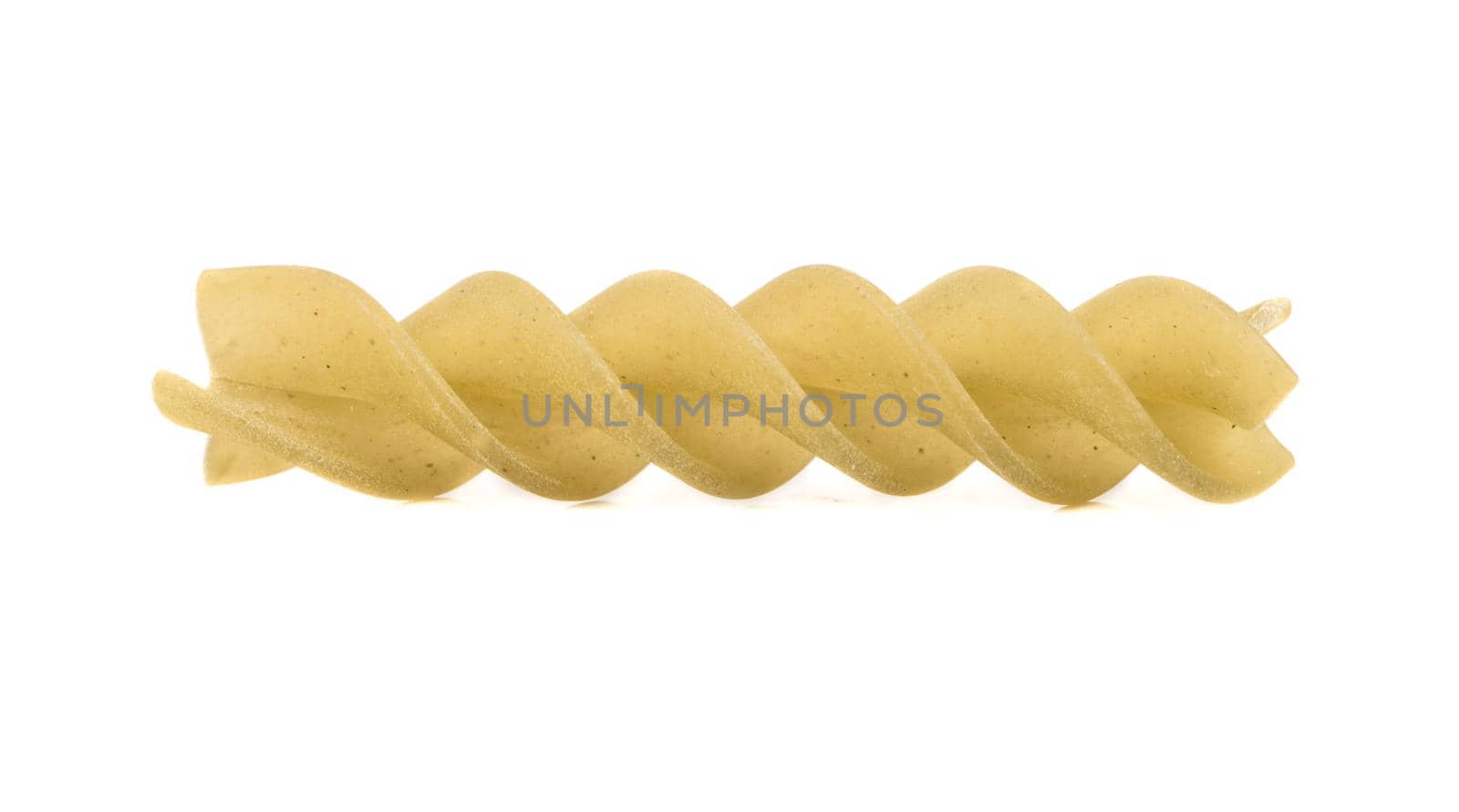 Uncooked pasta fusilli isolated on white background
