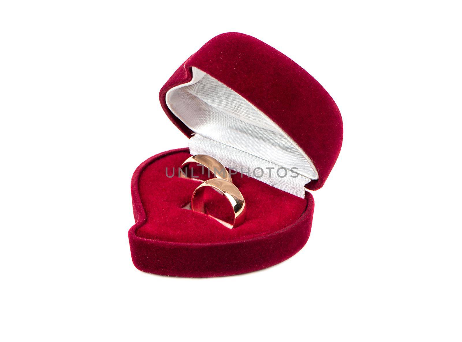 Two wedding rings in red box on white background