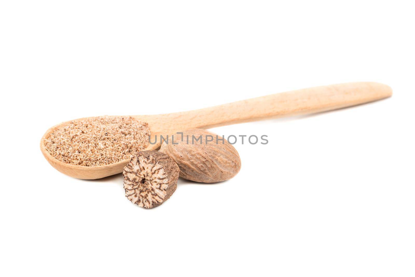 Wooden spoon with nutmeg spice isolated on white background