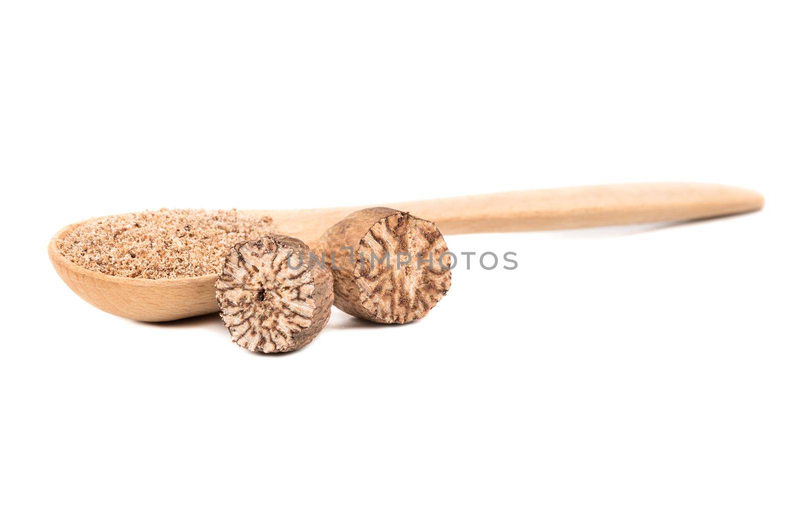 Wooden spoon with nutmeg spice isolated on white background