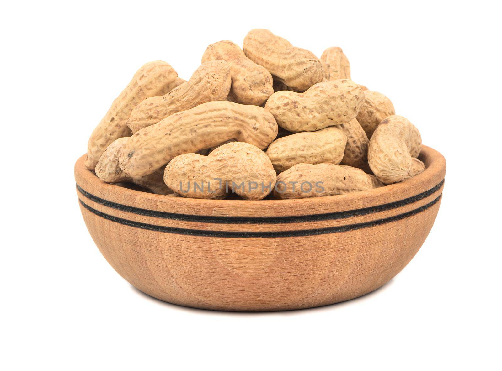 Peanuts in the shell and a wooden bowl isolated on white background