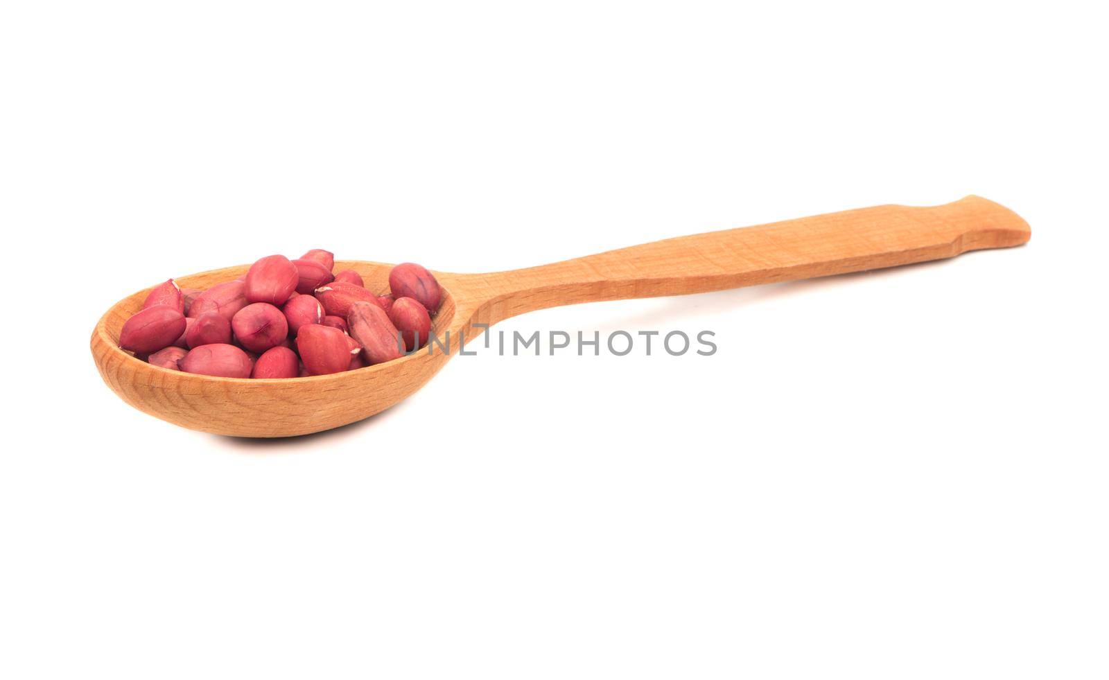 Kernel peanut in wooden spoon isolated on white background