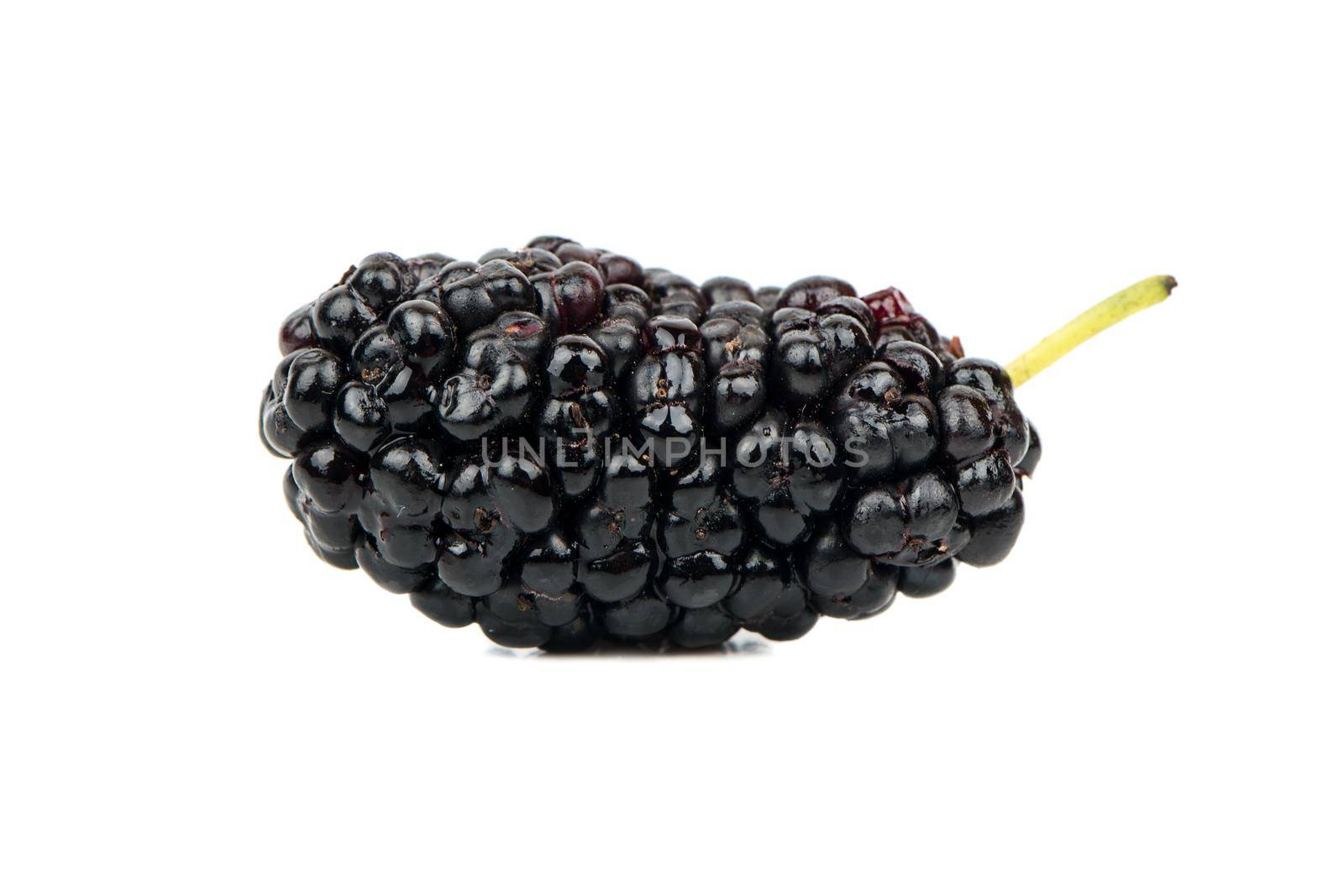 Big black mulberries isolated on white background