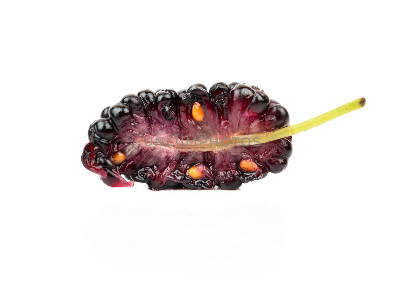 Juicy half black mulberry isolated on white background